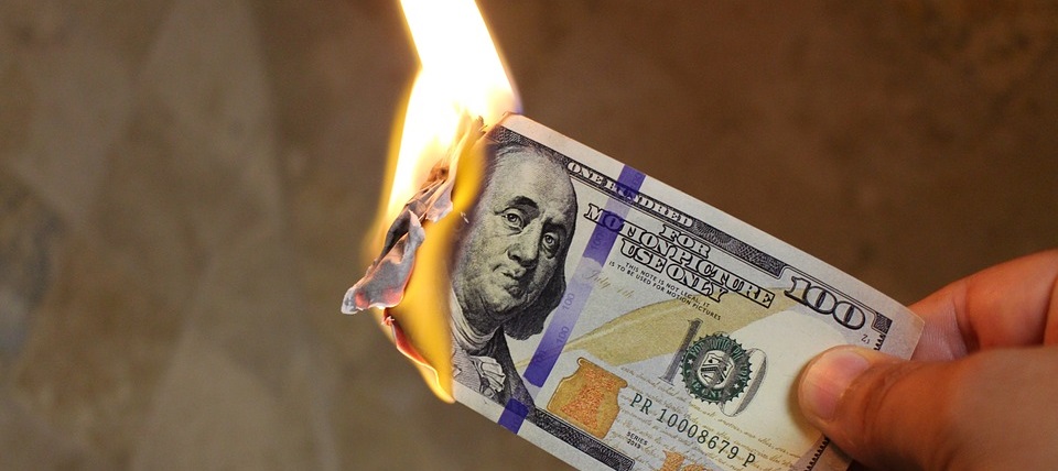 Burning US dollar bill
